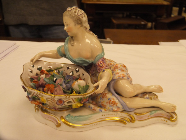 A pair of 19th Century Meissen figures as a recumbent gentleman and lady with baskets of flowers, - Image 24 of 48