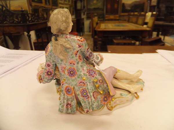 A pair of 19th Century Meissen figures as a recumbent gentleman and lady with baskets of flowers, - Image 4 of 48