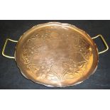 A Joseph Sankey & Sons embossed copper tray in the Art Nouveau taste,