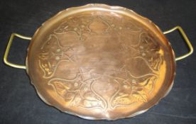 A Joseph Sankey & Sons embossed copper tray in the Art Nouveau taste,