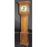 An 18th Century oak cased long case clock with moulded pediment above the thirty hour movement with