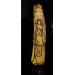 A Chinese carved bone netsuke as a bearded man, a sword in his right hand, 9.