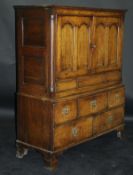 A 19th Century oak cupboard with Cavetto moulded cornice above two panelled doors enclosing a shelf,