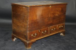 A 19th Century oak mule chest, the four plank top above a plain body,