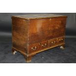 A 19th Century oak mule chest, the four plank top above a plain body,