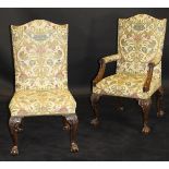 A set of eighteen George II style mahogany and upholstered dining chairs on carved cabriole legs to