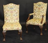 A set of eighteen George II style mahogany and upholstered dining chairs on carved cabriole legs to