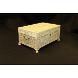 A mid 19th Century Chinese carved ivory sewing casket profusely and finely carved with a procession