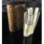 A crocodile skin cased travel knife, fork and tumbler set, 9.