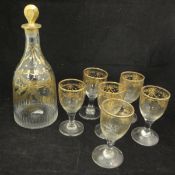 A 19th Century French cut glass and gilded decanter of mallet form,