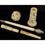 A 19th Century Chinese carved ivory puzzle ball, two carved ivory cheroot holders,