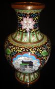 A 20th Century Chinese cloisonné vase with a black ground decorated with three panels featuring