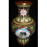 A 20th Century Chinese cloisonné vase with a black ground decorated with three panels featuring