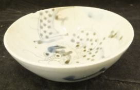 A Chinese blue and white bowl with central dragon or exotic beast decoration raised on a circular