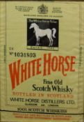 A framed and glazed "White Horse Fine Old Scotch Whisky" Irish linen panel with printed decoration,