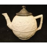 An early 19th Century relief ware bullet-shaped pottery teapot with all over prunus blossom