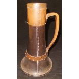 A Victorian Doulton Lambeth silicone jug of simulated leather form with studded plated copper