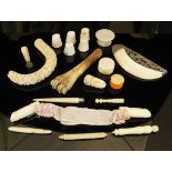 A collection of various carved ivory and bone items to include apple corer, counters, thimbles,