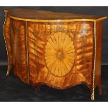 A satinwood and marquetry inlaid serpentine fronted side cabinet in the manner of John Cobb,