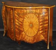 A satinwood and marquetry inlaid serpentine fronted side cabinet in the manner of John Cobb,