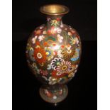 A Chinese cloisonné vase, the bronze coloured ground decorated with flower heads,