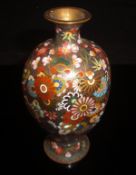 A Chinese cloisonné vase, the bronze coloured ground decorated with flower heads,