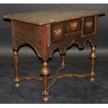 An 18th Century North Country oak and walnut cross-banded lowboy,