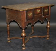An 18th Century North Country oak and walnut cross-banded lowboy,