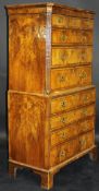An early 18th Century walnut and feather-banded chest on chest,