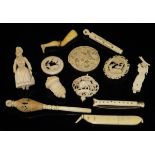A collection of various carved ivory and bone items including a combination ear spoon / toothpick