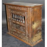 An 18th Century and later wall hanging oak food cupboard,