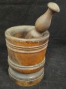 An 18th Century turned Lignum Vitae pestle and mortar,