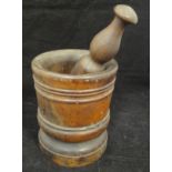 An 18th Century turned Lignum Vitae pestle and mortar,