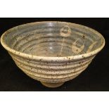 A mid 20th Century studio pottery bowl of ribbed form,