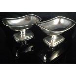 A pair of George III silver rectangular pedestal salts with gadrooned edge (by Abstinando King,