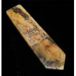 A Chinese carved moss agate pendant of elongated pentagonal form with panel of scrollwork to the