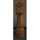 An 18th Century oak long case 30 hour clock with swan neck pediment flanked by painted orbs on a