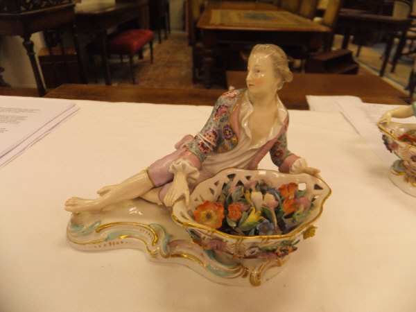 A pair of 19th Century Meissen figures as a recumbent gentleman and lady with baskets of flowers, - Image 2 of 48