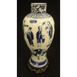 A Chinese blue and white baluster shaped vase decorated with various figures and Swastika emblems