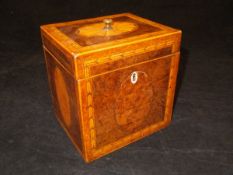 A George III burr walnut marquetry and parquetry inlaid tea caddy of rectangular form,