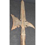 A 17th Century German Halberd with shaped blade on a faceted iron bound pole (Provenance: Coughton