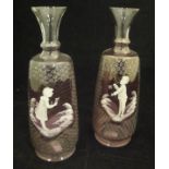 A pair of pale amethyst and white enamel decorated Mary Gregory style vases,