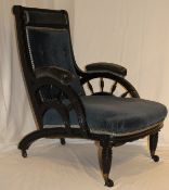 A rare Victorian Aesthetic Period ebonised framed armchair after the original design by Edward