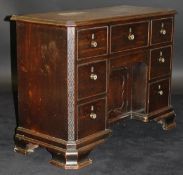An early 19th Century mahogany kneehole desk / dressing table of small proportions,