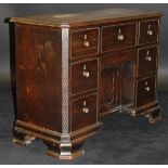 An early 19th Century mahogany kneehole desk / dressing table of small proportions,