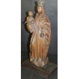 A late 17th Century carved oak figure of The Madonna and child,