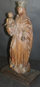 A late 17th Century carved oak figure of The Madonna and child,