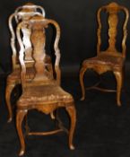 A set of four 18th Century Dutch walnut and marquetry inlaid dining chairs,