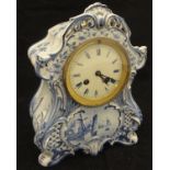 A blue and white faience cased mantle clock,