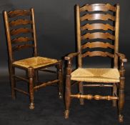A set of twelve assorted 19th Century oak ladder back dining chairs including four carvers with